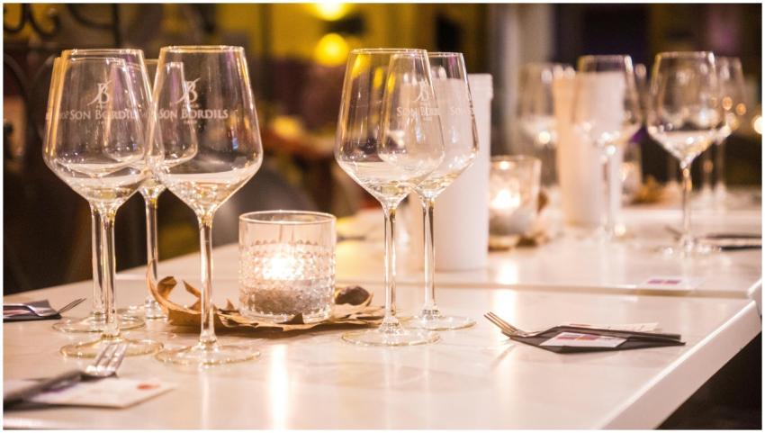 Elegant dinner table setting with glasses and cand