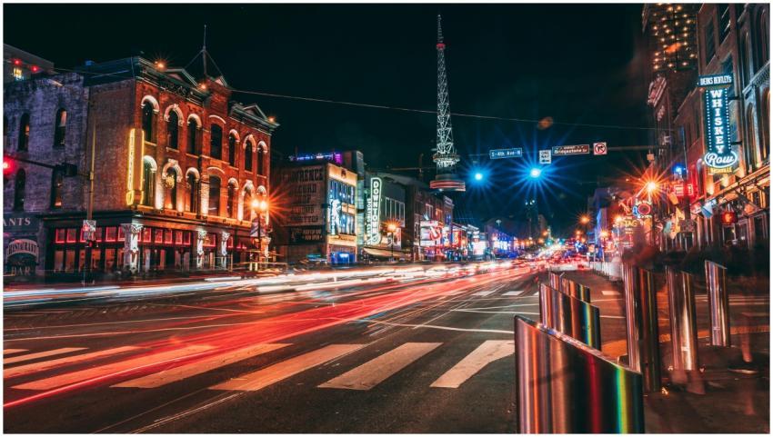 Dynamic city street scene at night with vibrant li