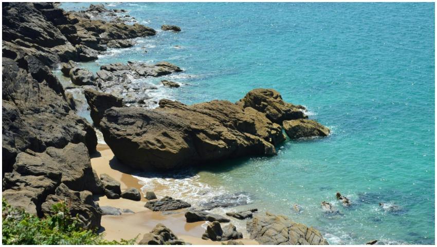 Sunny coastal view of the rocky shoreline in Canca