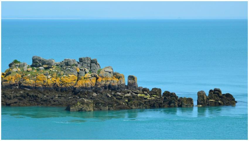 Beautiful rocky outcrop in the turquoise waters of