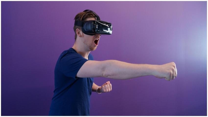 Caucasian man immersed in virtual reality using VR