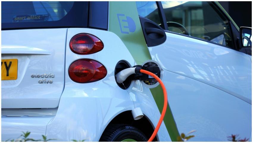 Close-up of an electric car being charged, highlig