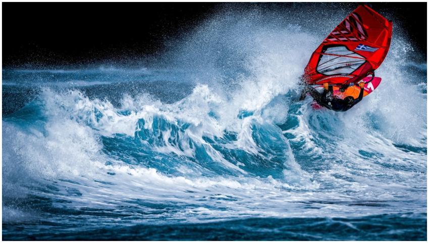 Dynamic windsurfing scene with vibrant colors and