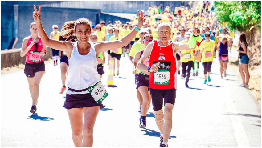 A group of diverse runners participating in a live