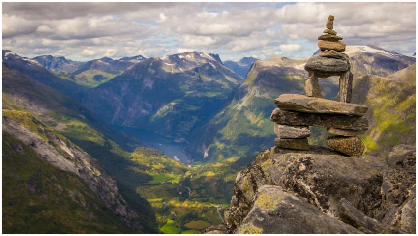 Tranquil mountain landscape with stacked stones at
