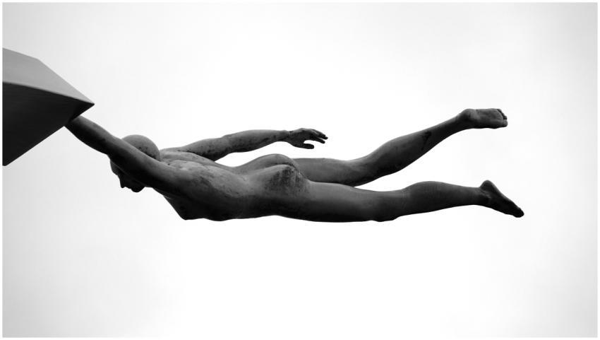 Black and white image of a sculpture depicting a f