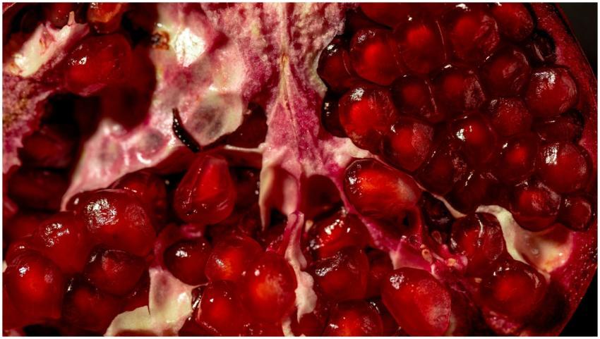 Close-up of vibrant pomegranate seeds showcasing r