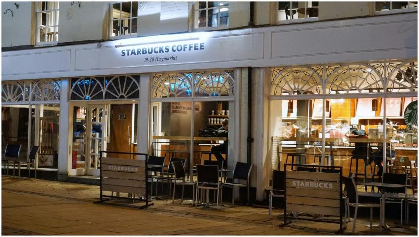 A cozy Starbucks café in Norwich with inviting ext