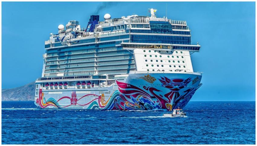 A colorful cruise ship sailing on the open sea und