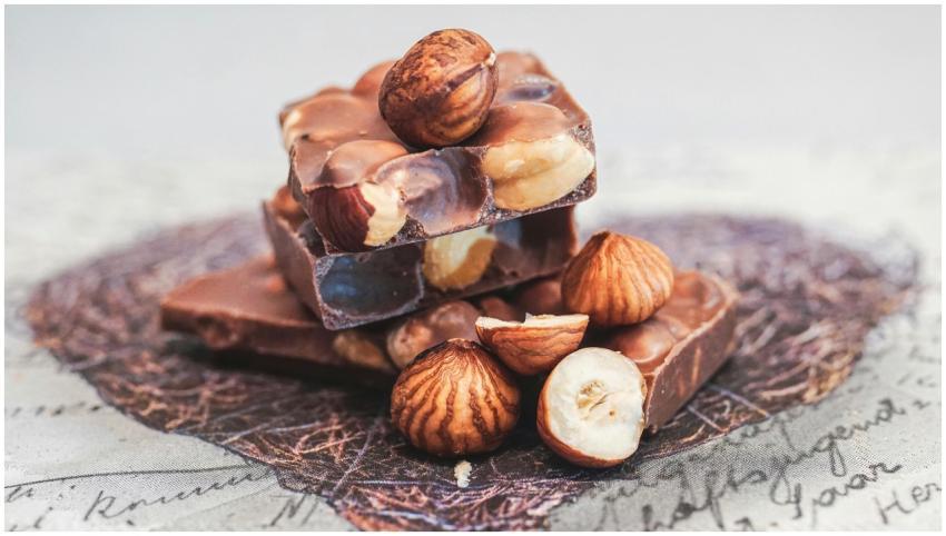 Close-up of stacked chocolate bars with whole haze