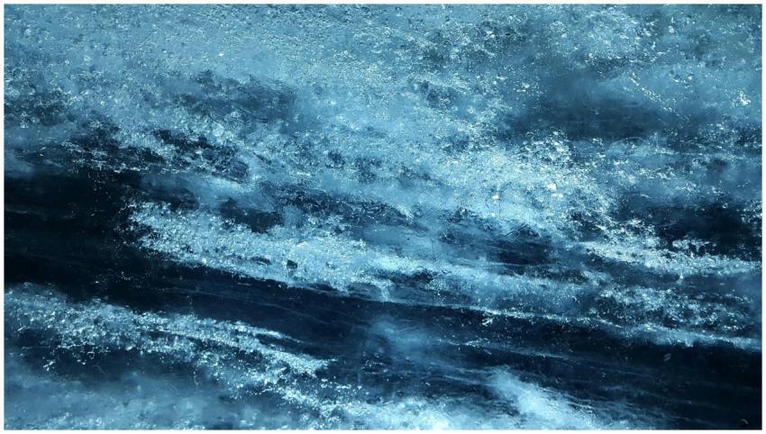 Close-up view of textured blue ice surface, captur