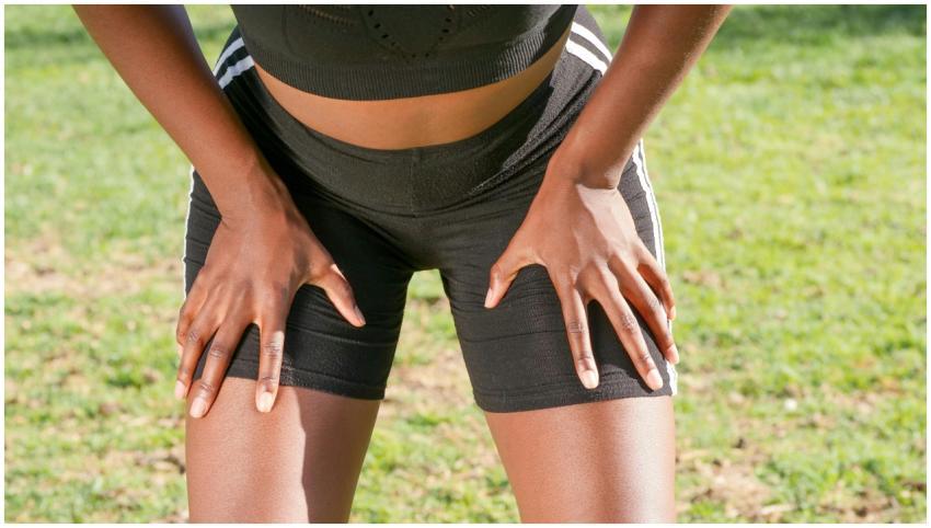 Close-up of a fit woman in activewear resting afte