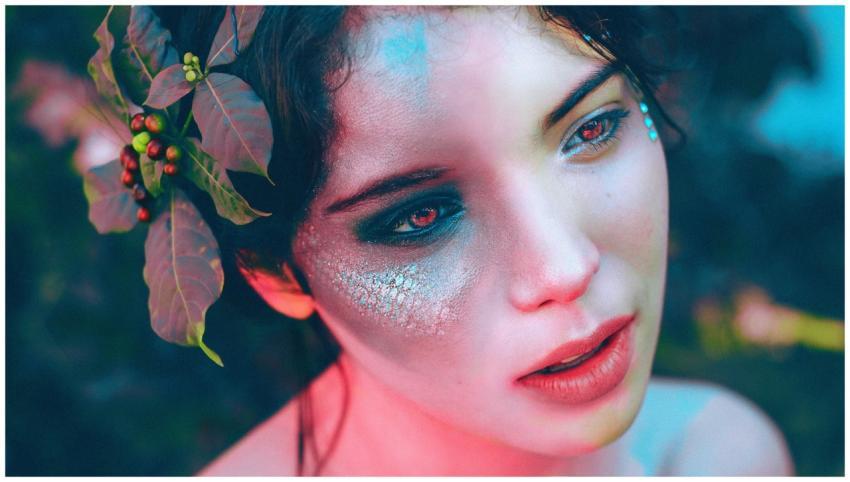 Artistic portrait of a woman with unique makeup an