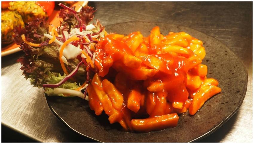 Enjoy a vibrant plate of spicy Korean tteokbokki p