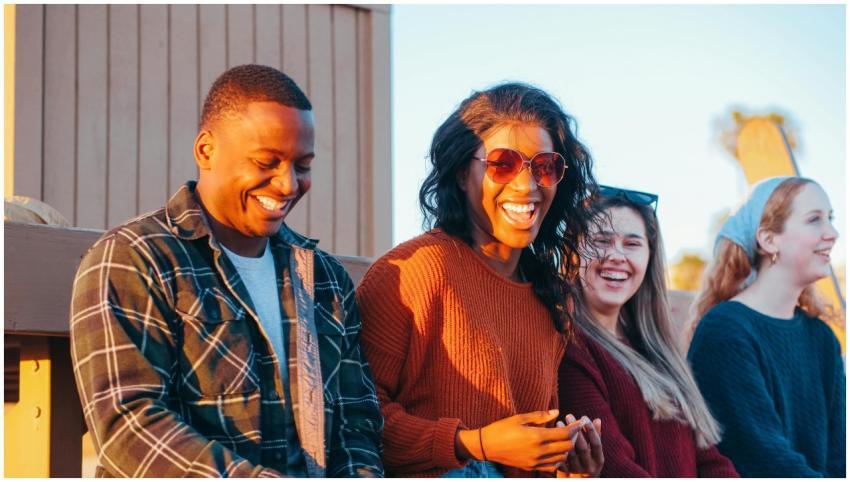 A group of diverse friends enjoy a fun moment at s