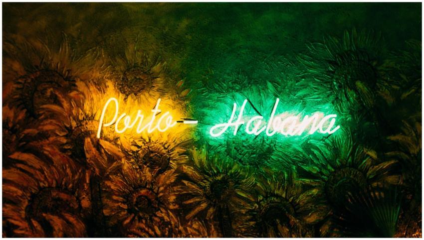 Vibrant neon sign displaying 'Porto-Habana' agains