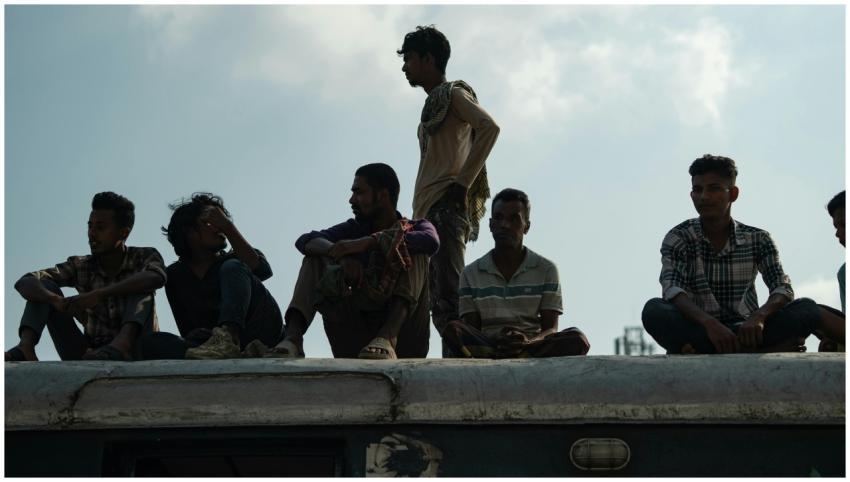 Men Sitting Train Roof