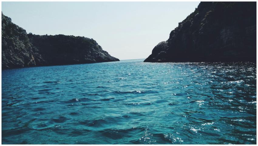 Breathtaking view of a serene ocean with distant r