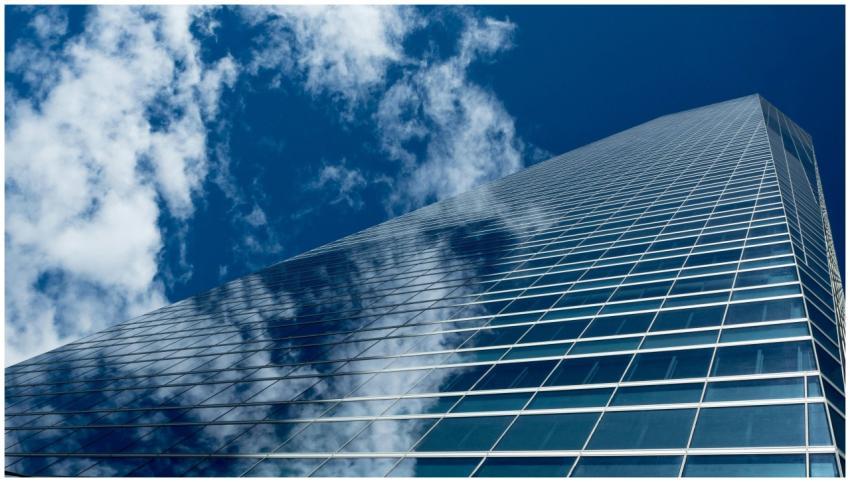 Low-angle view of a modern skyscraper with reflect