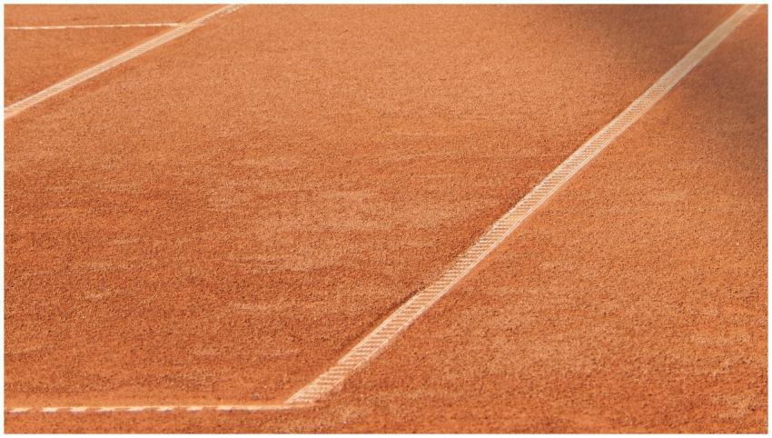 Close-up of a clay tennis court highlighting the d