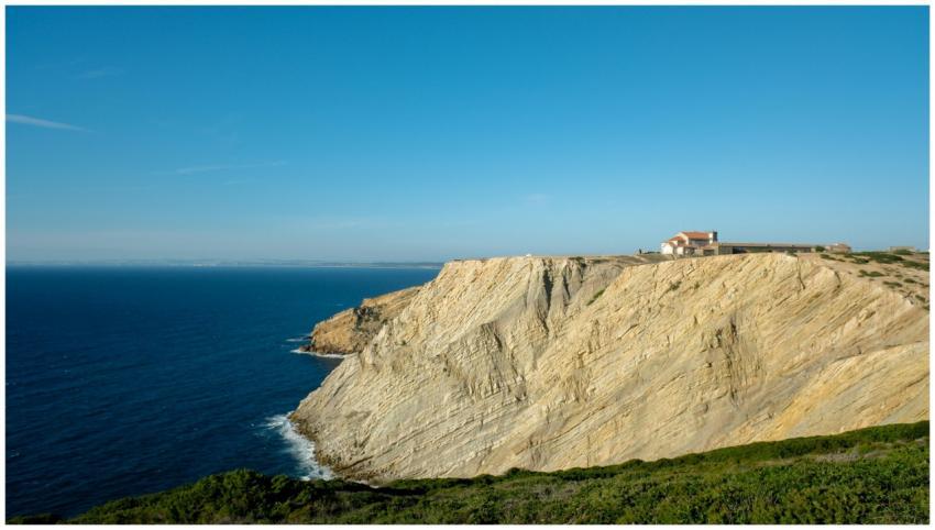 Stunning view of Cape Espichel cliffs and the blue