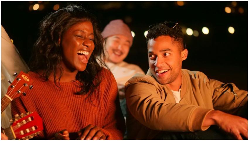Group of friends enjoying a lively beach gathering