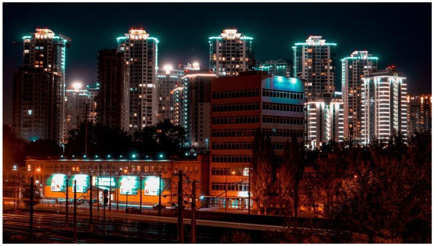 A vibrant city skyline with illuminated skyscraper