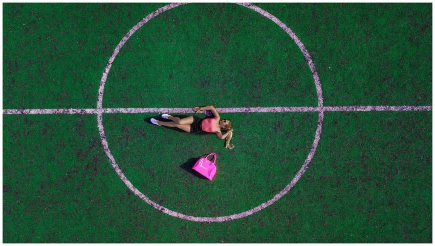 Aerial shot of a woman in stylish attire relaxing