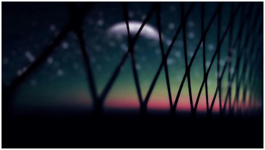 A dreamy abstract view of the moon and stars throu