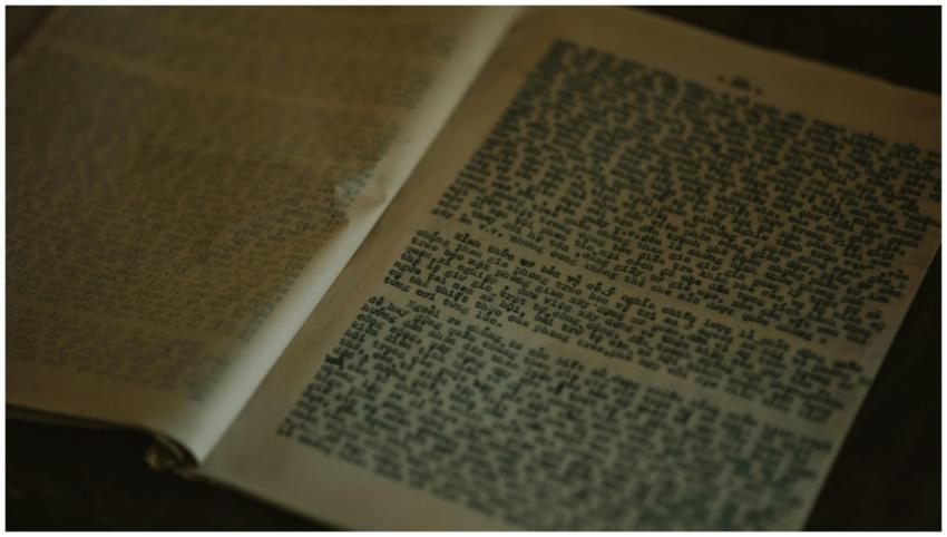 Close-up of vintage book pages with weathered text