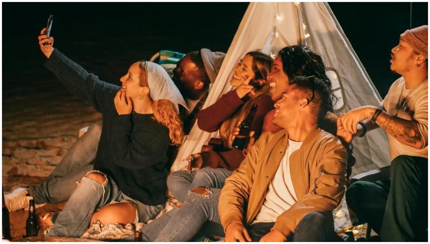 A diverse group of friends enjoying a lively beach