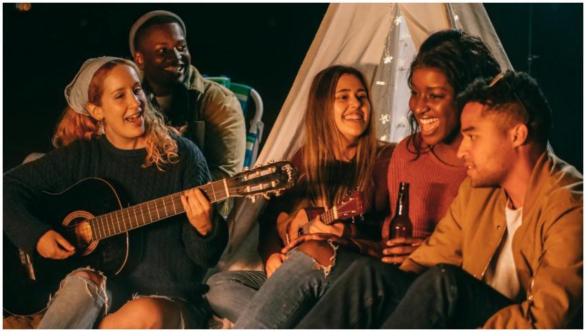 A group of friends enjoying a musical evening with
