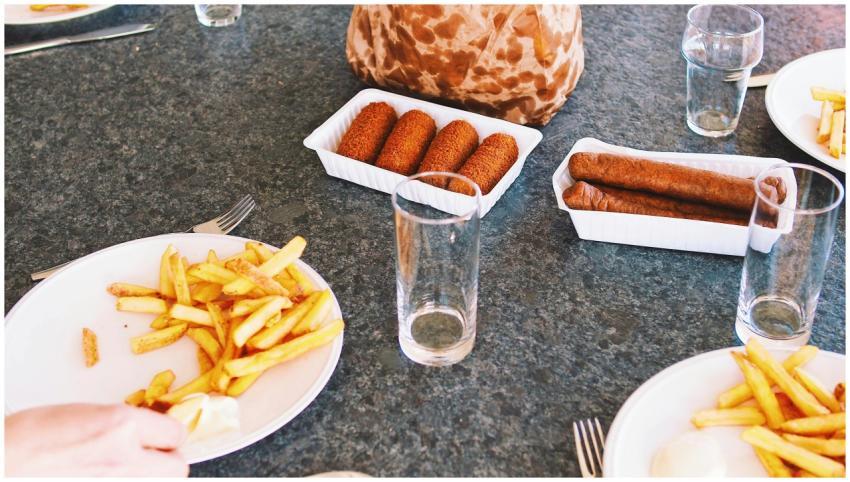 A casual lunch setting featuring french fries, sau