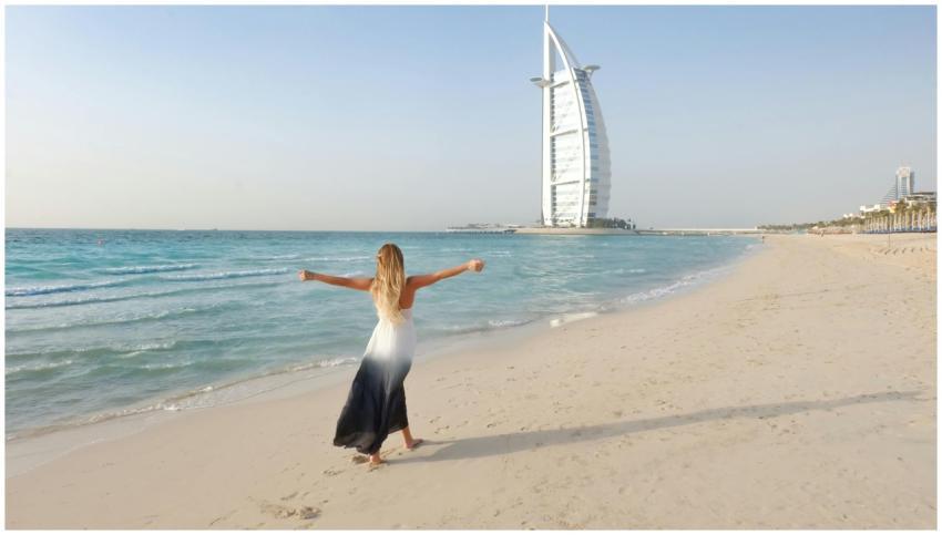 A carefree woman in a flowing dress strolls along