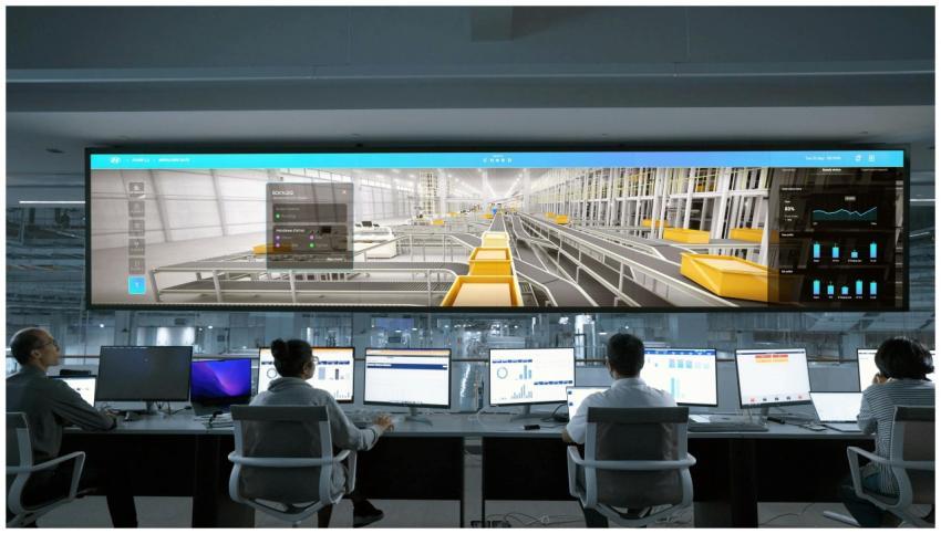 Modern control room with people monitoring large d