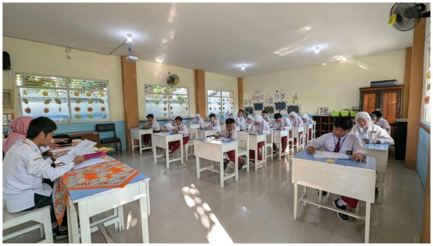 Students in an Indonesian classroom taking an exam