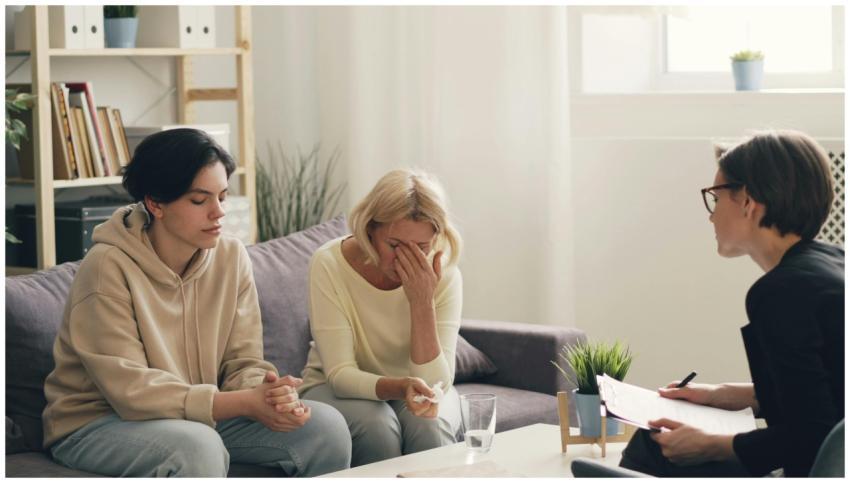 Emotional family therapy session with a therapist