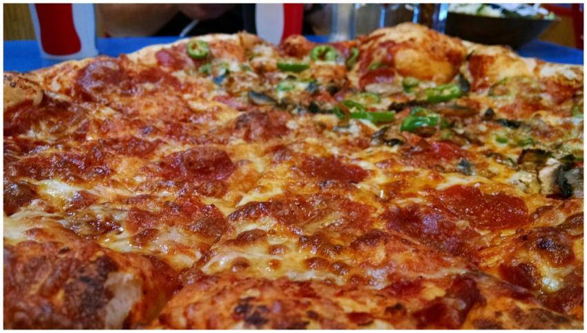 Mouthwatering close-up of a pepperoni and cheese p