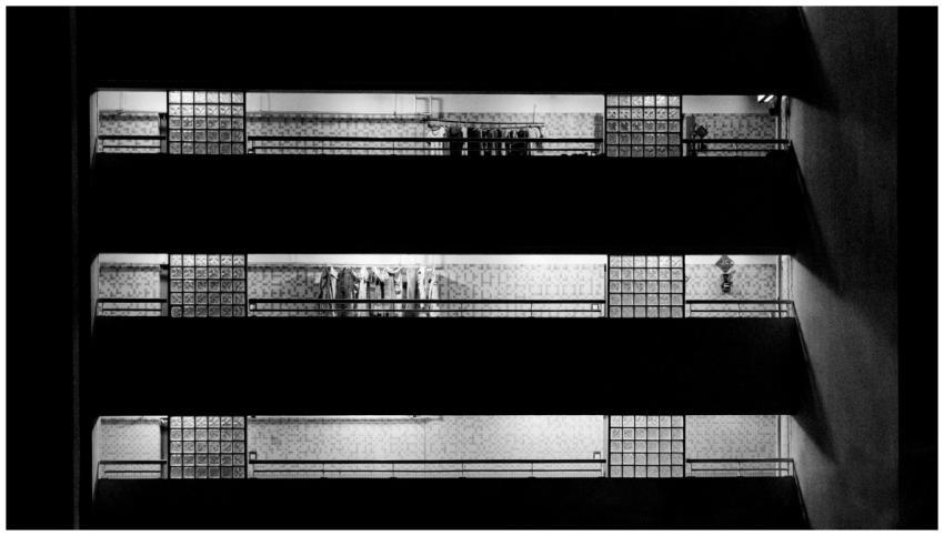 Moody black and white photo of a building's interi