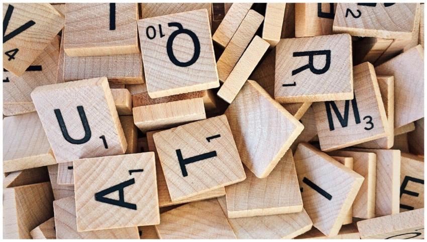 Close-up of wooden Scrabble tiles showcasing lette