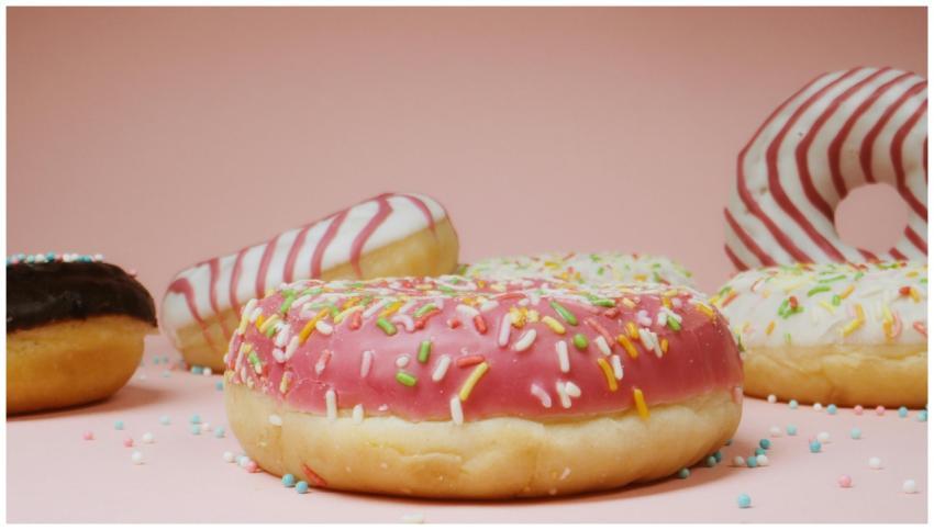 Close-up of assorted donuts with colorful icing an