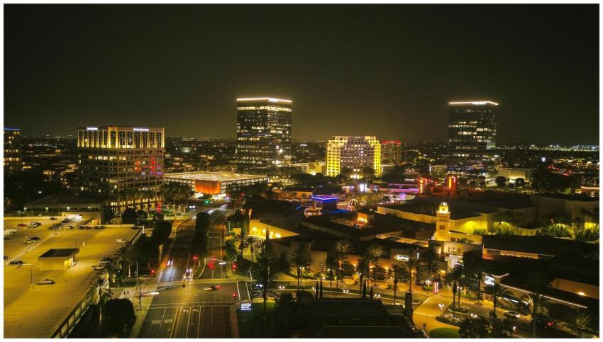 A stunning aerial view of a city illuminated at ni