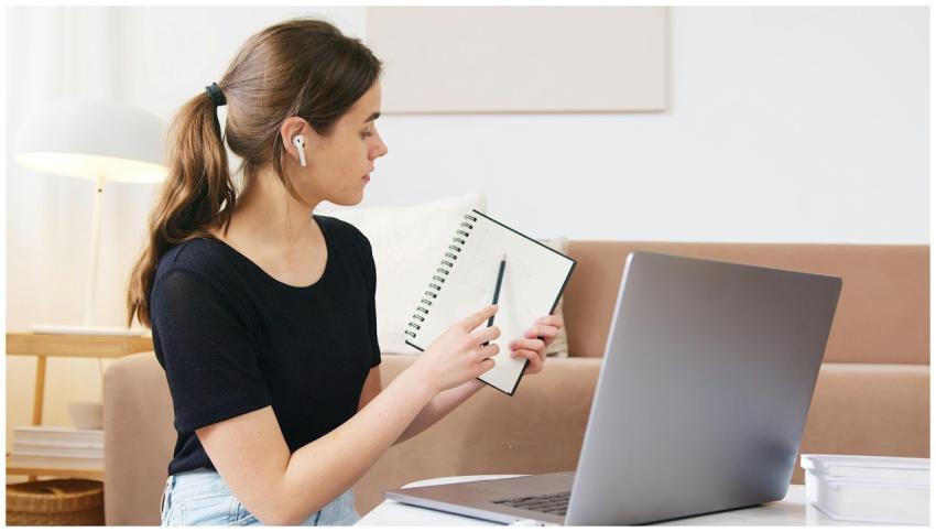 Female student engaging in online learning with la
