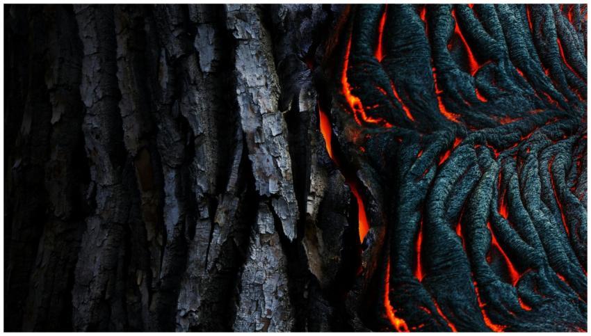 Vivid abstract of glowing lava texture against dar