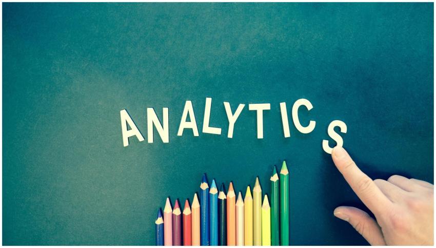 Colored pencils and letters spelling 'ANALYTICS' o