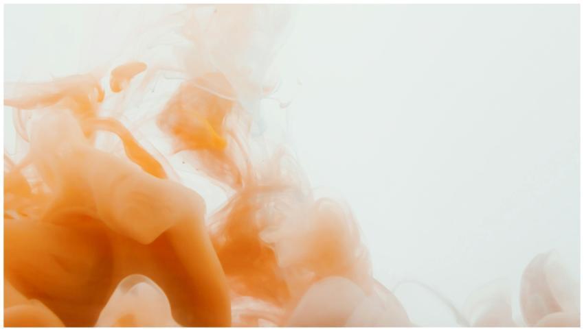 Captivating abstract image of orange ink swirling