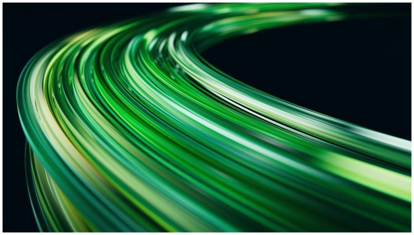 Abstract image of green light trails on a dark bac