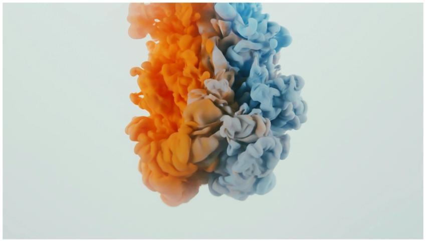 Vibrant swirls of orange and blue ink creating an