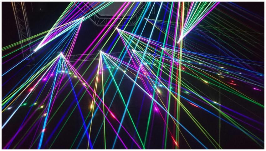 Dynamic multicolor laser beams create an electrify