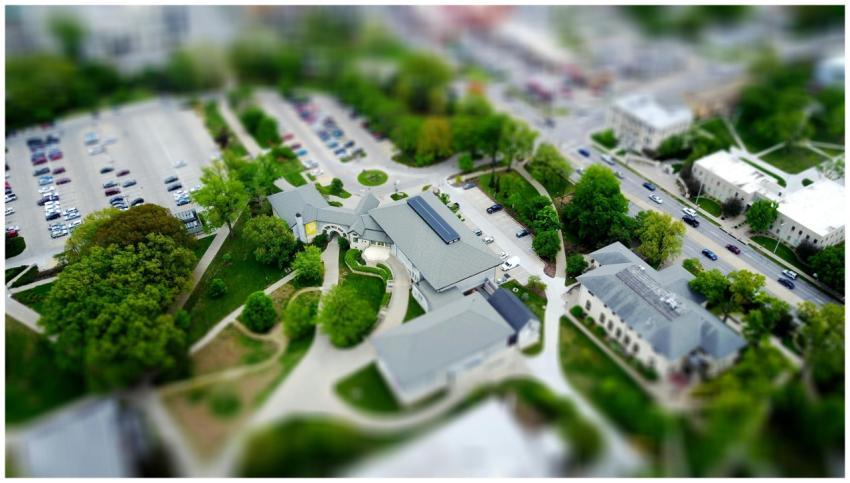 Aerial view of campus with green landscaping and p